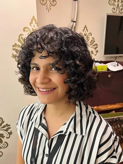 Another look at this versatile curly bob, which brings out the hair's natural texture and volume.