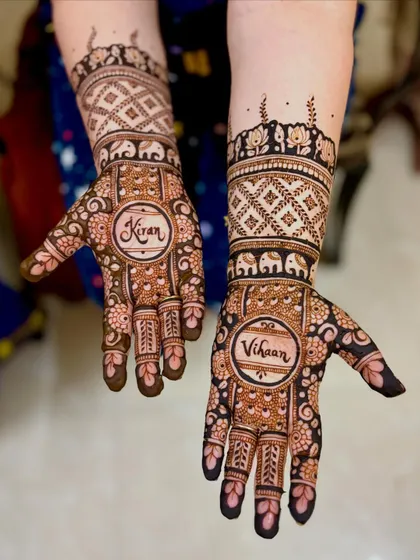 The complete design for Shubha, with her son's name "Kiran" on one hand and "Vihaan" on the other.