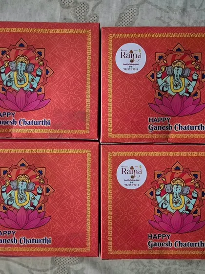 Four of my festive Ganpati boxes, each with my personal brand sticker. It's a pleasure to be a part of my clients' celebrations.
