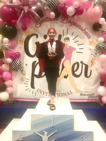 Anabella, one of our Diamond athletes, celebrates her 1st place all-around win at the Svetlana Invitational.