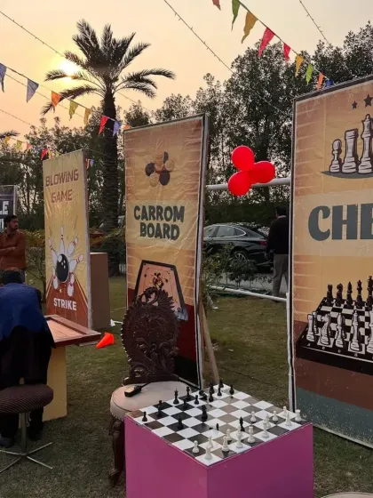 As the sun set on this pre-wedding game night, the festive atmosphere continued. Our well-lit game stations for chess, carrom, and bowling ensured the fun could go on well into the evening.