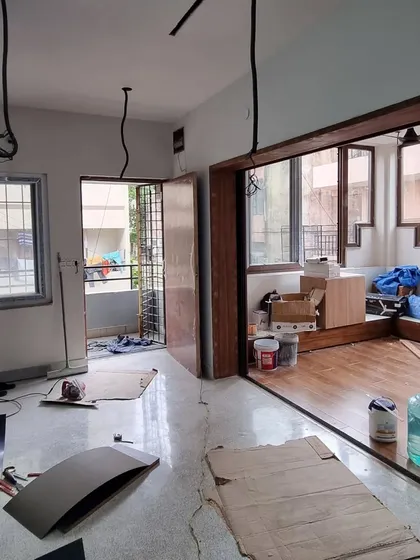 This before-and-after view of the dining and kitchen area highlights the power of opening up spaces. We replaced a solid wall and sliding door with a large opening and integrated shelving, creating a visual connection that makes the entire ground floor feel more spacious and sociable.