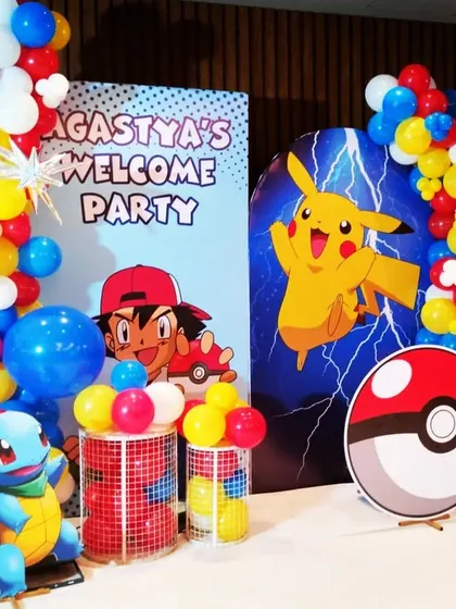 Gotta catch 'em all! A fun Pokémon-themed welcome party for Agastya, featuring Pikachu, Ash, Squirtle, and a giant Poké Ball, all brought to life with colorful balloons and cutouts.