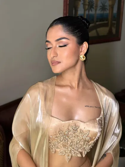 Another angle of the Latina glam, showing the flawless skin and perfect contour. This look is all about precision and creating a sculpted, defined face.