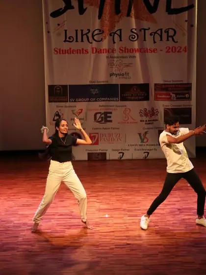 This action shot captures the fluid movement and expression in our students' hip-hop performance.
