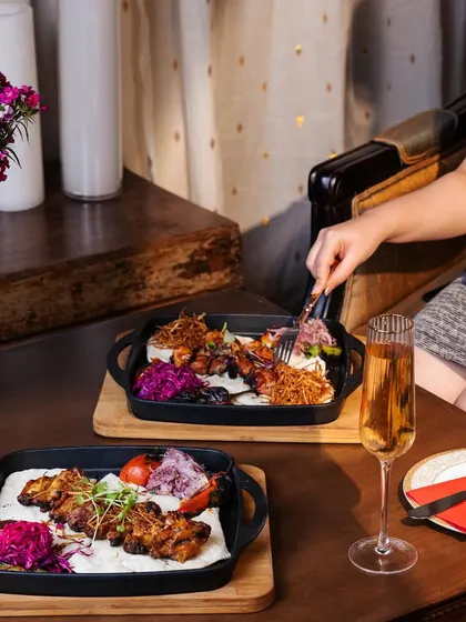 Unleash your inner epicurean with our gourmet chicken wings. Served on a sizzling platter, they are a symphony of flavor and finesse that elevates the ordinary to extraordinary.