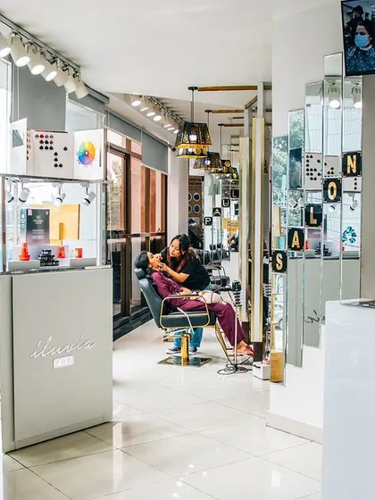 Our salon is equipped with professional products from brands like L'oreal and Schwarzkopf to give you the best results. You can see our product display and reception area as you walk in.