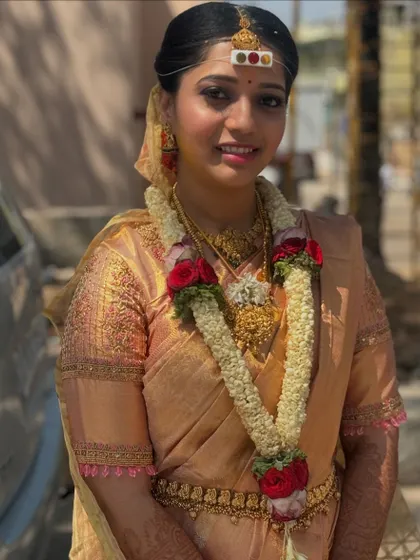 This photo shows the complete muhurtham look in natural light. The saree's pleats are neat, and the drape is comfortable for the bride as she moves between outdoor and indoor ceremonies.