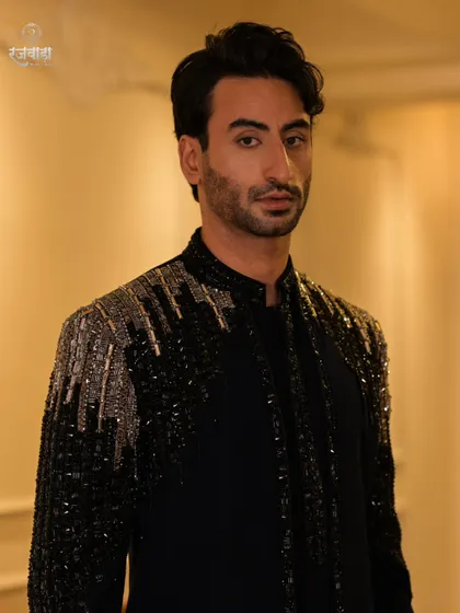 Make a powerful statement at your next evening event. This close-up highlights the cascading sequin and beadwork on one of my signature cocktail jackets, designed for maximum impact.