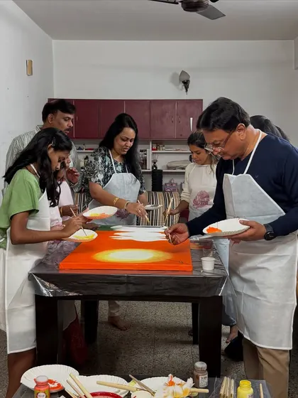 Imagine turning your living room into a mini art studio. That's what this family did for a birthday celebration, creating a large collaborative canvas together.