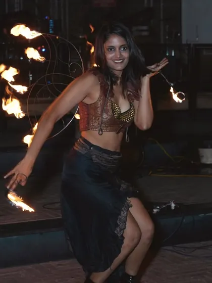 A shot from a corporate anniversary show for Shadowfax. Here I'm using fire wings and palm torches to create a multi-layered fire performance.