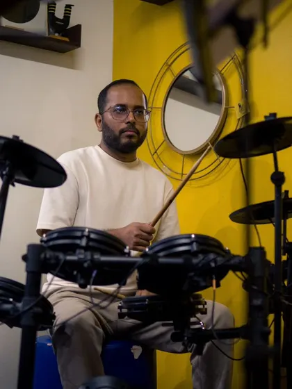 A drummer focused and in the zone. Our rehearsal and performance space allows musicians to lock in and deliver their best performance without distractions.