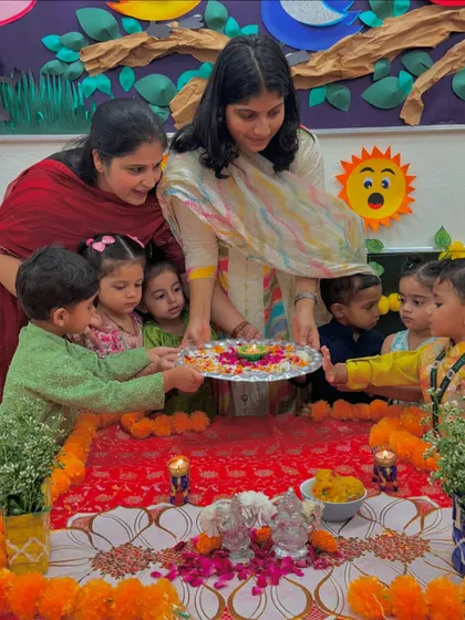 The children hold the puja thali together, learning about unity and shared celebration during Diwali. It was a beautiful moment of togetherness.