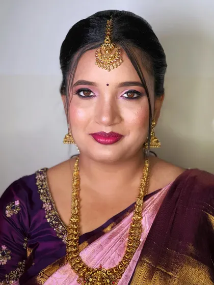 A smiling portrait of the bridesmaid, looking confident and beautiful.