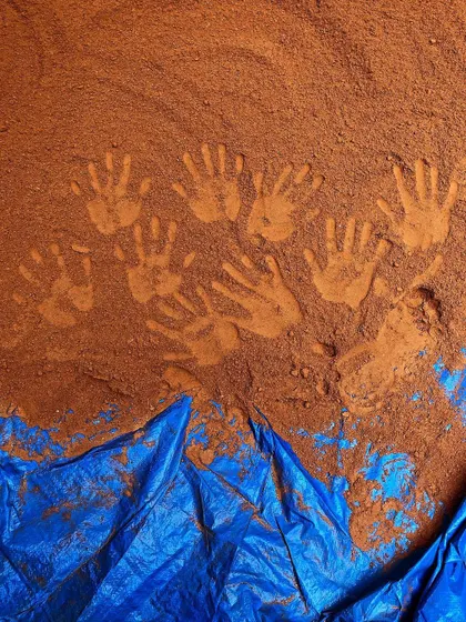 Handprints in the soil, a powerful symbol of our connection to the earth. This was part of the 'Soil Stories' exhibition, which invited people to explore their relationship with the ground beneath their feet.