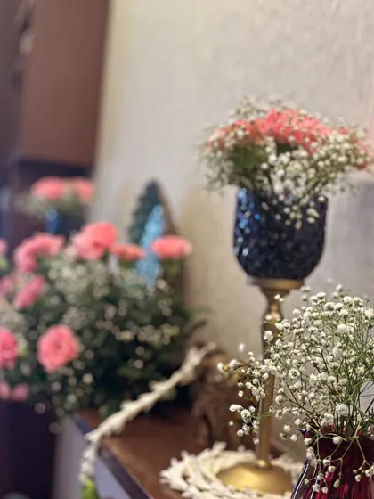 Small details make a big impact. These elegant vases filled with pink carnations and baby's breath are perfect for placing on mantels, side tables, or consoles to carry the floral theme throughout your space.