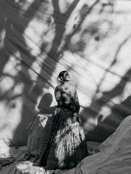 As architects, we are drawn to light and shadow. This black and white bridal portrait uses the stark contrast of shadows to create a fine art piece, highlighting the bride's elegance and the quiet emotion of the moment. It’s where documentary meets magazine style.