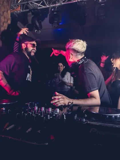 A great action shot of me and Ankytrixx pointing to the crowd, fully engaged in the performance.