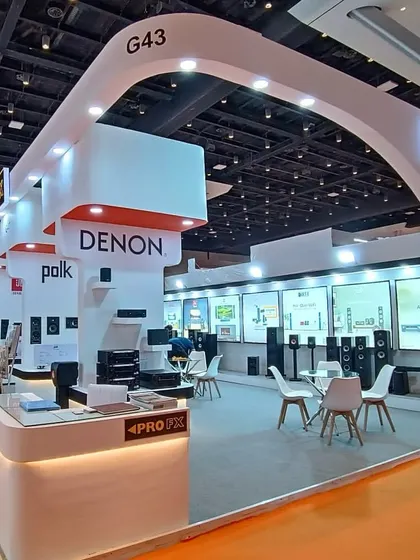 An alternate view of our professionally executed exhibition booth, showcasing our strong branding and the premium partners we represent, including Denon and Polk.