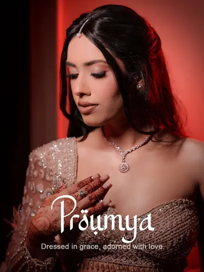 A close-up portrait of the beautiful bride Proumya, focusing on her delicate features, makeup, and the intricate details of her jewelry.