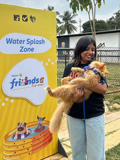 A repeat shot of our founder with a fluffy cat, showcasing the pet-friendly nature of our events for all types of furry companions.