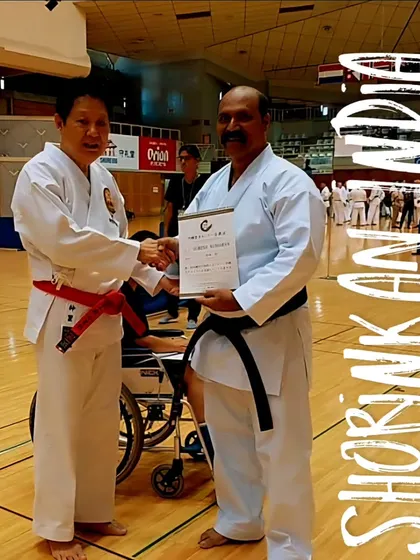 Receiving a certificate from Hanshi Minoru Nakazato, the 10th Dan Red Belt and world chairman of Shorinkan, in Okinawa, Japan. These moments represent our direct connection to the leadership of our karate style.