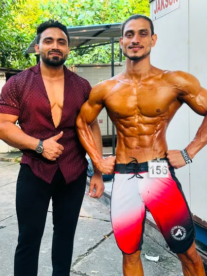 With a client who also won a silver medal. We train together, we win together.