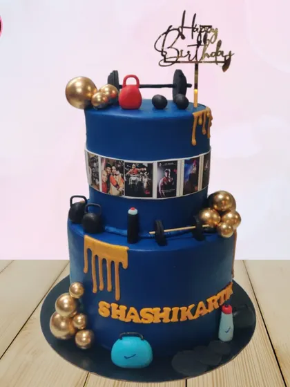 This two-tiered gym-themed cake is for the fitness enthusiast in your life. It's decorated with detailed, edible gym equipment like dumbbells and kettlebells, and even features a photo reel of personal fitness milestones.
