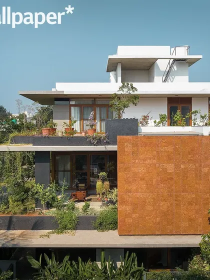 An elevated view from the Wallpaper* feature, showing the multi-level terraces and rooftop garden that make the landscape accessible at every floor.