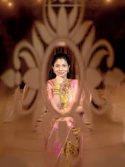 A beautiful solo portrait of the bride seen through the same patterned glass, creating an artistic and elegant effect.