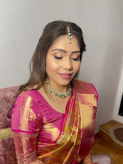 A close-up of the soft eye makeup and radiant skin, perfect for this traditional yet modern look.