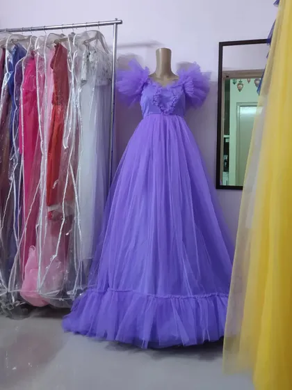 A full view of the lavender ruffled gown on a mannequin, showing its beautiful volume and texture. This is available for rent for maternity or pre-wedding shoots.