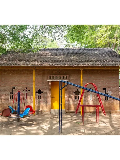 Originally a bus shelter, this arts classroom for the Spastic Society of Karnataka was built in just five weeks on a tight budget. Now standing for decades, its playful brickwork and accessible design show that thoughtful architecture can be both temporary and timeless.