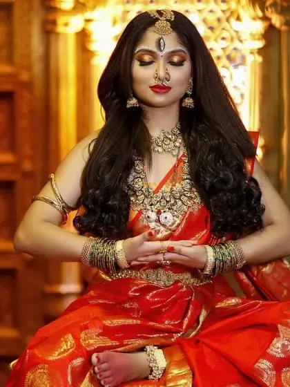 A meditative pose from the Devi-themed shoot. The heavy necklaces, Vaddanam, and headpiece are all part of our extensive rental collection.