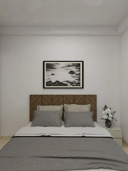 The bedroom area of the same project features a simple, modern design with a wooden chevron headboard and neutral tones, creating a calm and restful environment.