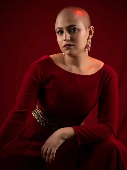 A portrait from the red dress series. The soft, glowing makeup and simple styling highlight her natural beauty and poise, proving that elegance comes from within.