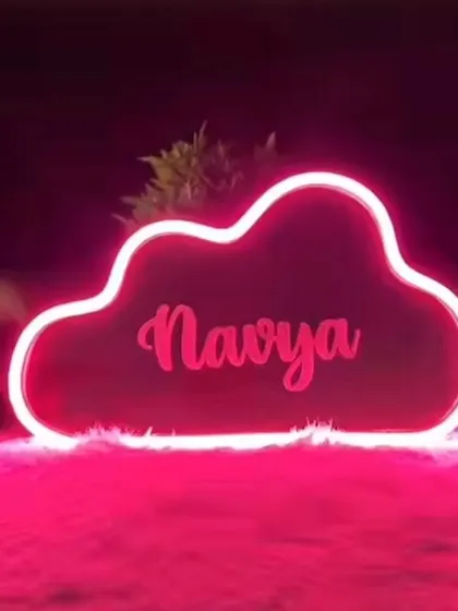 This sign was created in a bright pink neon for "Navya," perfect for adding a pop of color to a room.