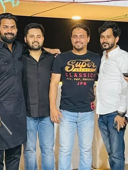 Posing for a group photo with friends at an evening program. My circle of friends and colleagues is a great source of support.