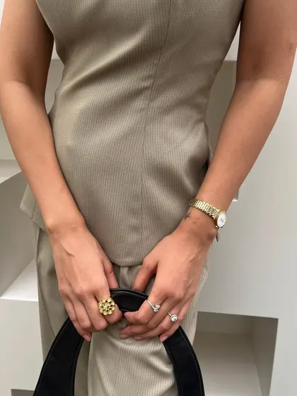 A close-up on the details of my monochrome powersuit. The corduroy texture of the fabric adds interest, while the simple gold watch and ring keep it classic.