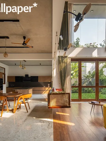 This split view featured in Wallpaper* magazine shows the open-plan layout, connecting the dining and kitchen area with the double-height living pavilion.
