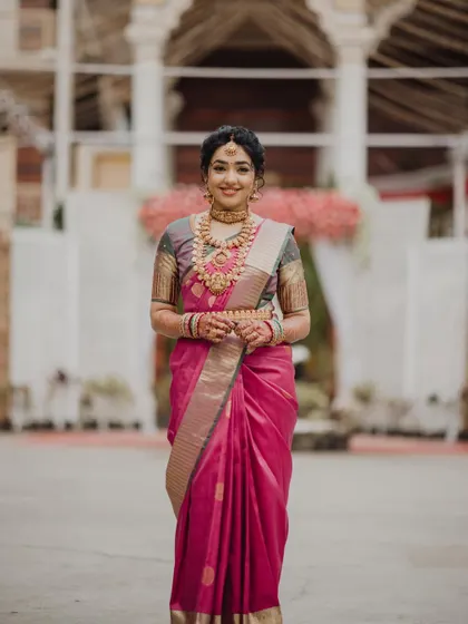 A beautiful portrait of the bride. Her makeup is classic and timeless, perfectly complementing her traditional attire.