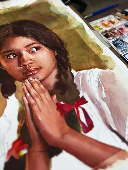A work-in-progress shot of the young girl's portrait, showing the painting on my easel next to my palette. This gives a glimpse into my color mixing and artistic process.