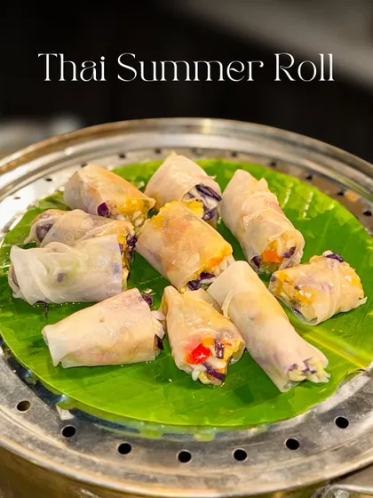 My Thai Summer Rolls are a fresh and healthy option for any event. These rice paper rolls are packed with crunchy vegetables and served on a banana leaf for an authentic touch.