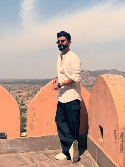 Ruling the world from a fort. A simple kurta and cargo pants create a cool, contemporary ethnic look.