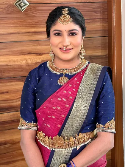 The bride's smile says it all. Her makeup is designed to enhance her happiness and create a look of timeless beauty.