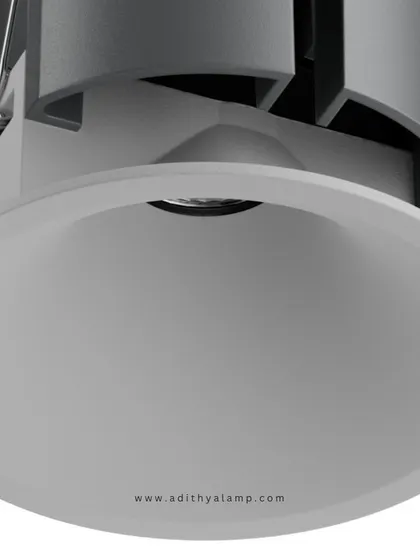 This image displays our recessed downlight with a clean, white reflector and trim. It is designed to blend seamlessly into white ceilings, offering a soft, diffused light that is perfect for general ambient illumination in any modern space.