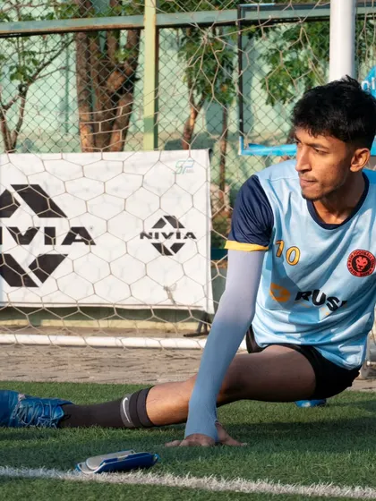A candid shot of one of our players, Akayraz, stretching before a game.
