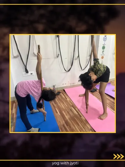 Young students also learn to use props like sticks for correct alignment in their twisting poses.