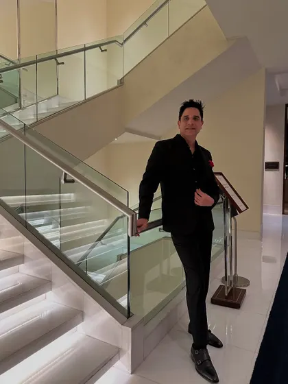 A sharp, focused look in an all-black ensemble. This reflects the professional and polished approach I take to every event I'm a part of.