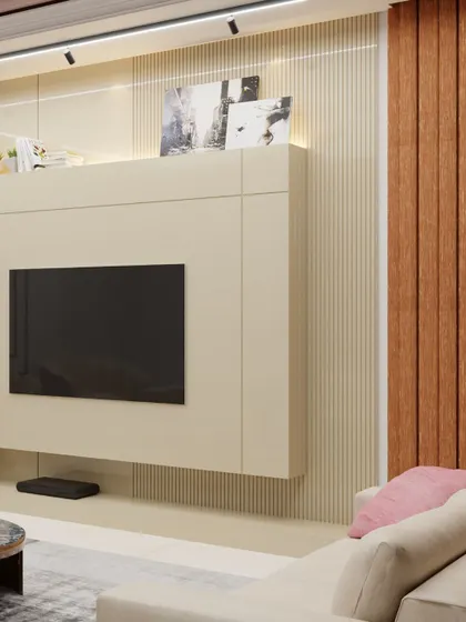 Our client dreamed of a modern space with a touch of the ocean. We designed this custom TV unit with a sleek white finish and a unique shell-patterned backrest, keeping the space light and airy.